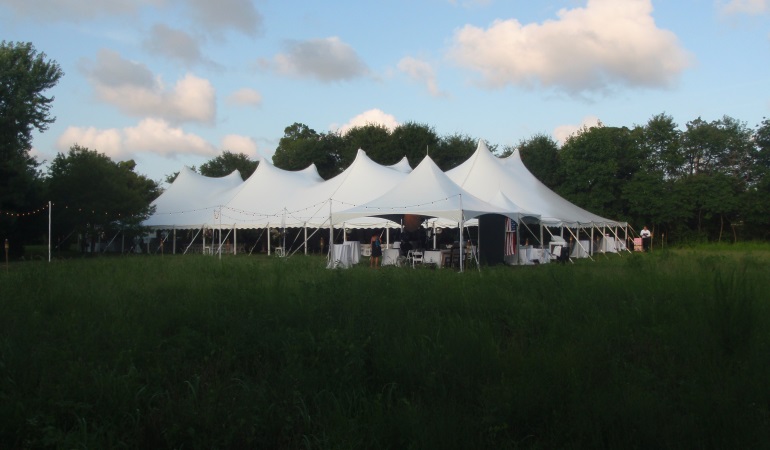white high tension tent in a open field