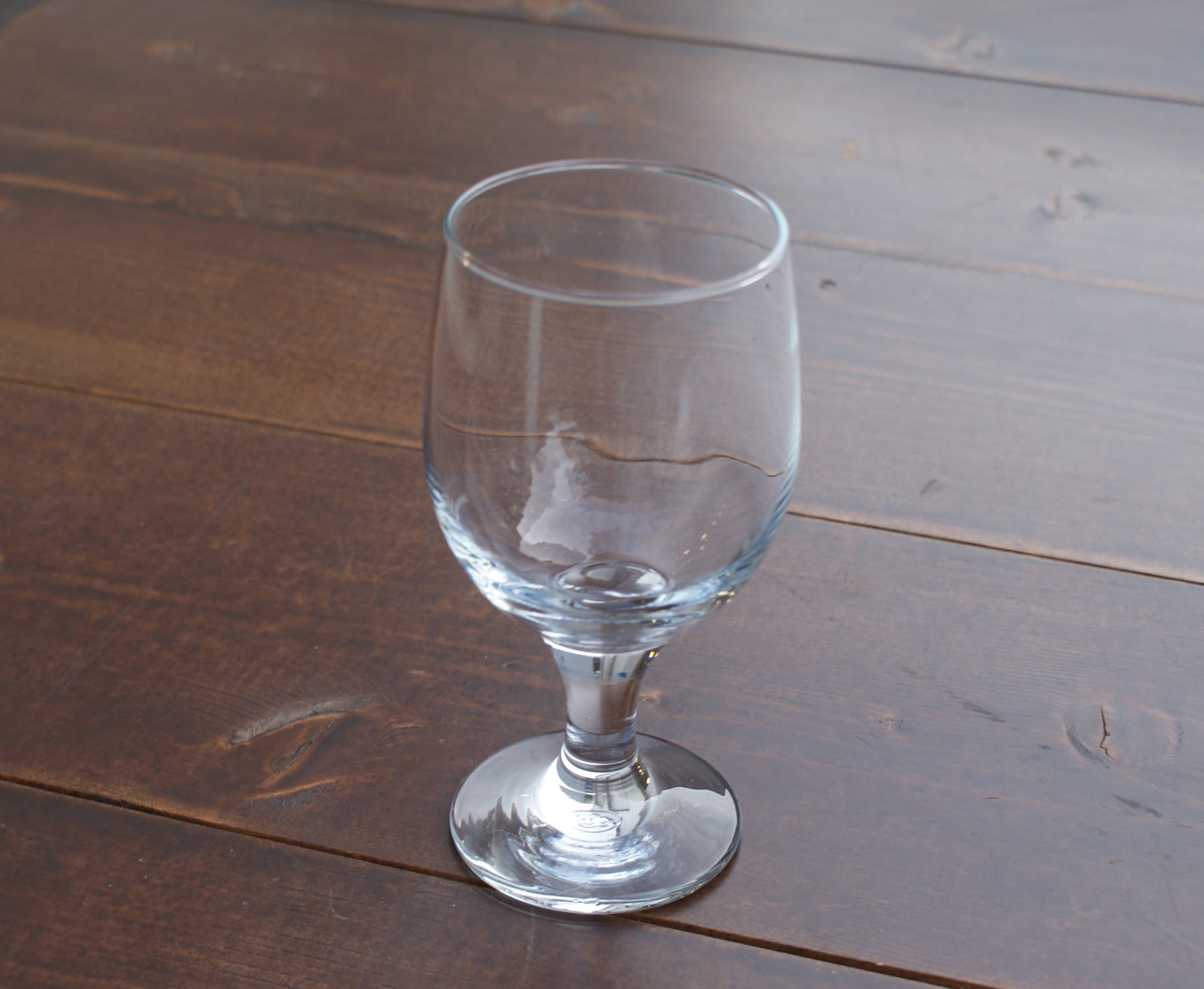 all purpose goblet glass on a wood table