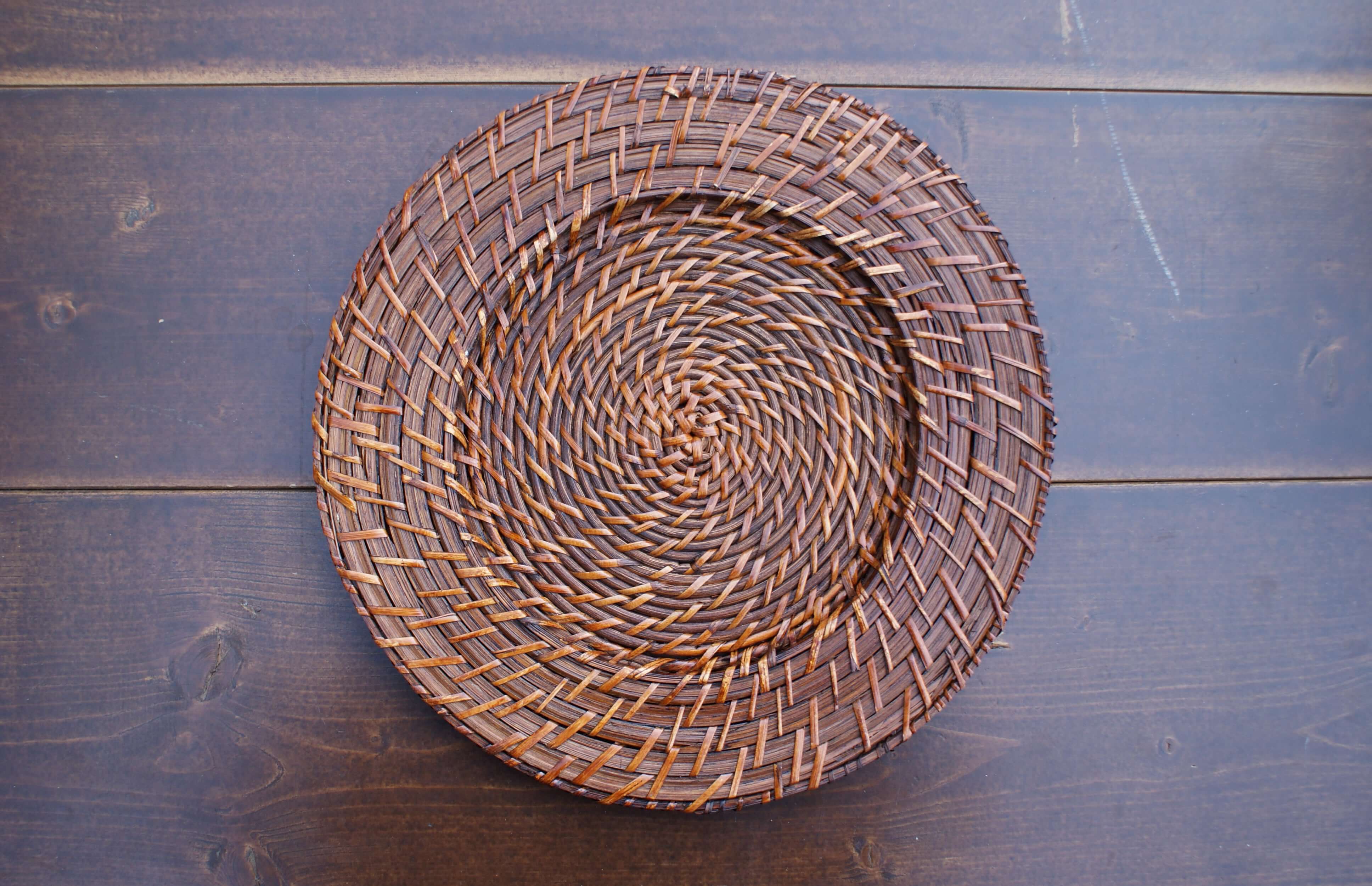 large round rattan on a wood table