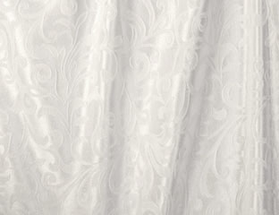 close up of white linen with subtle damask pattern