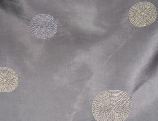 gray fabric with silver circles