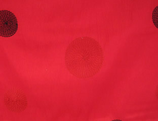 red taffeta fabric with red and purple circles