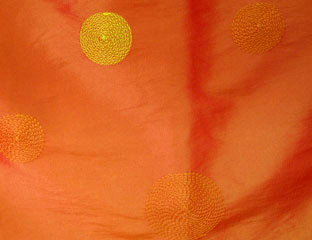 orange taffeta fabric with yelllow circles