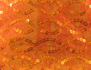 orange fabric with orange sequins