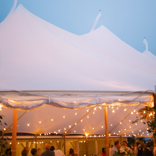 large white tent with string lights