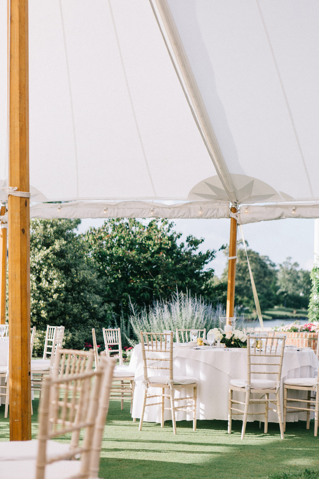large white tent with white tables and chairs