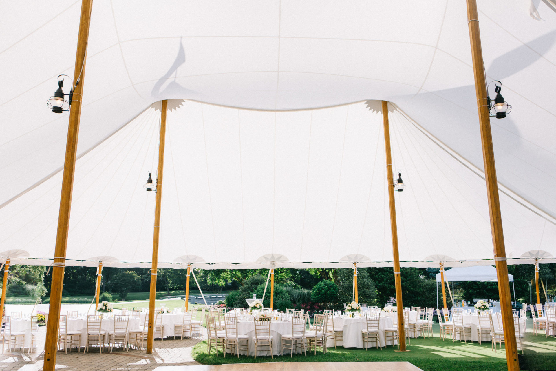 large white tent with lantern lights