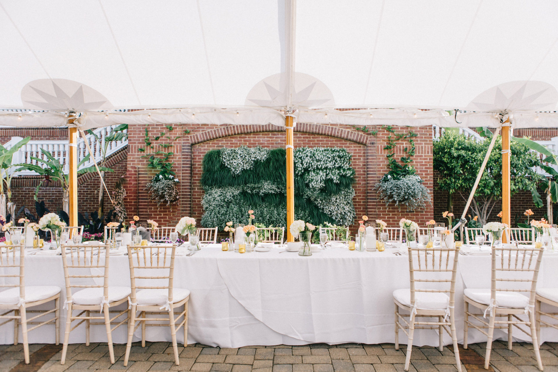 large white tent with white tables and chairs