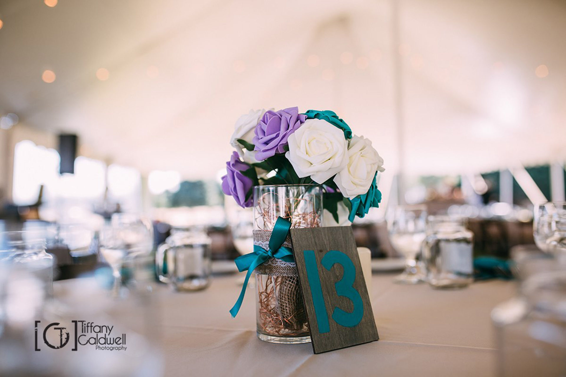 white and purple roses on table 13