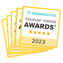 stack of yellow awards from wedding wire, the top being for 2023